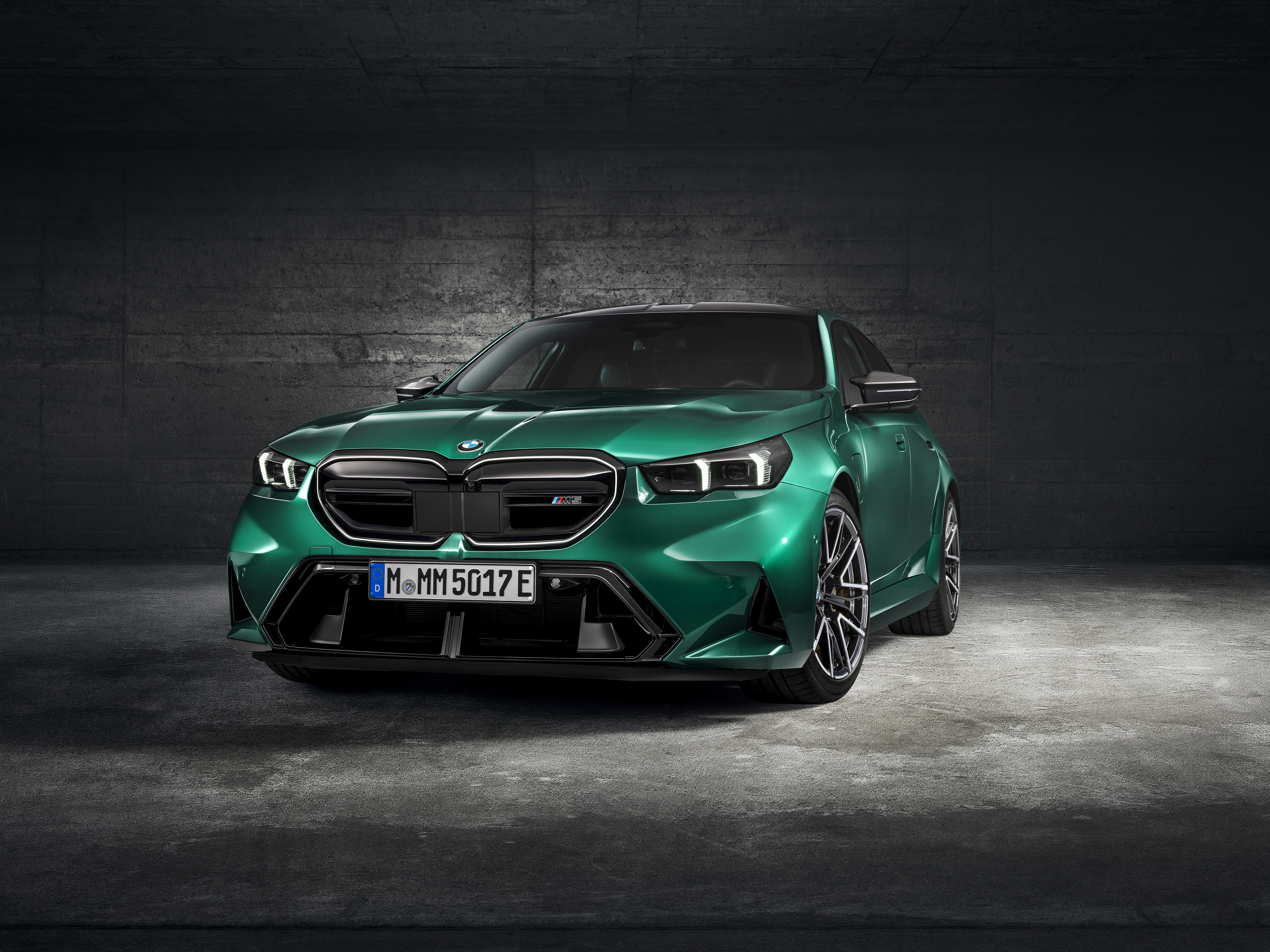 Front view of a BMW M5, highlighting the grille, headlights, and bumper design.