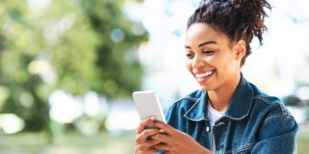 girl planning EV charging on phone