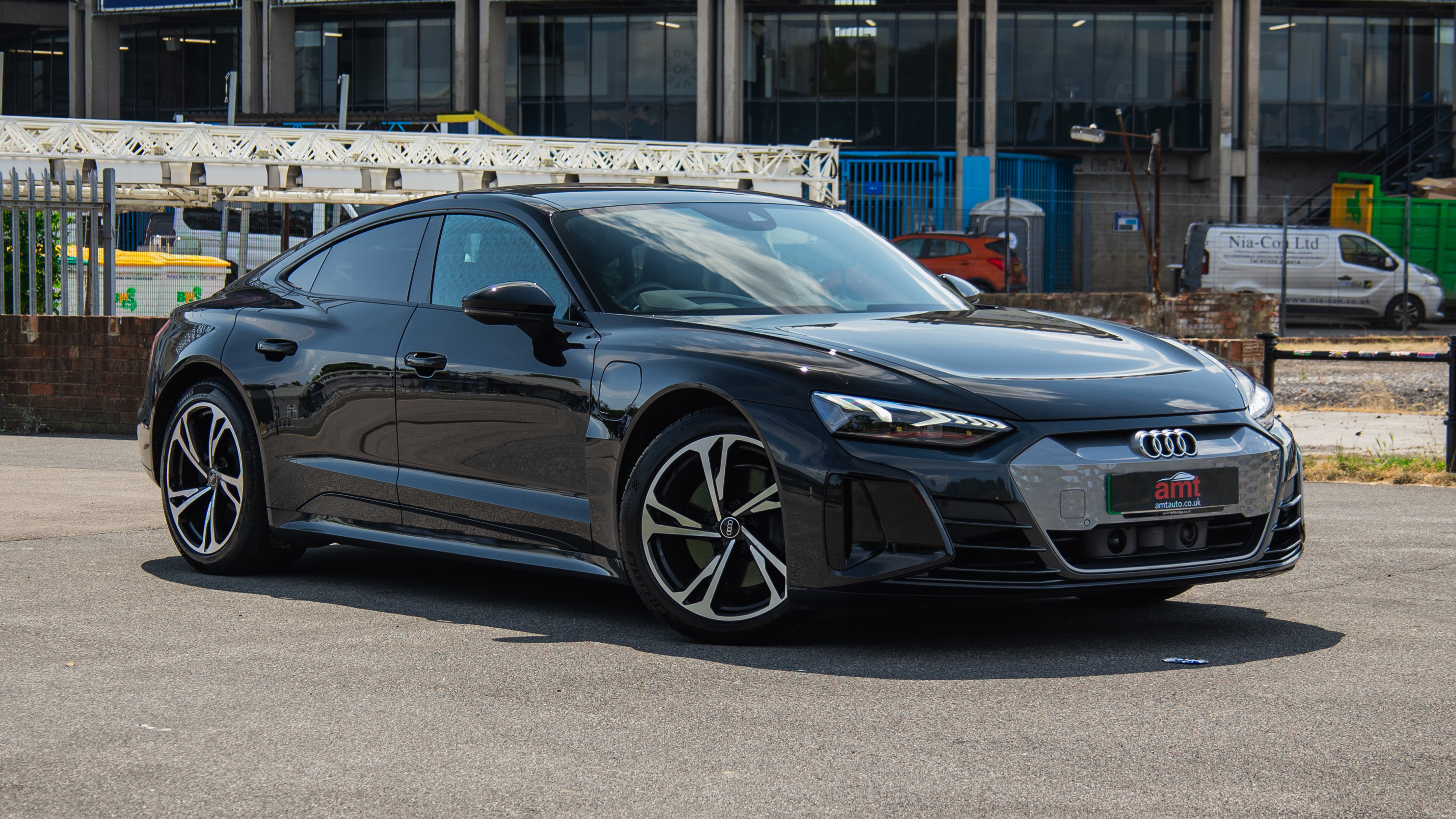 Audi e-tron GT electric saloon parked outside, available on lease from AMT Auto.