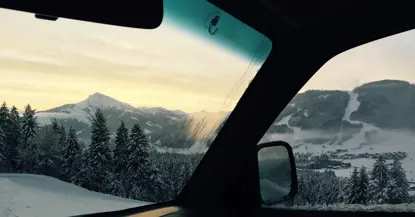 An image showing a car windscreen in an icy environment