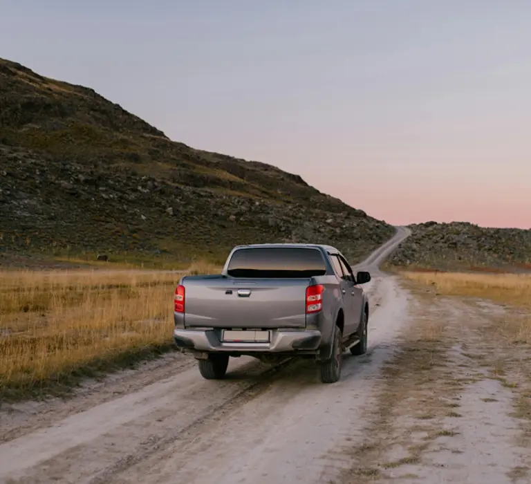 Pickup truck on a rural dirt road