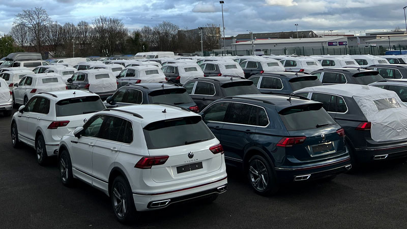 An image showing Volkswagen Tiguans in stock on a car park
