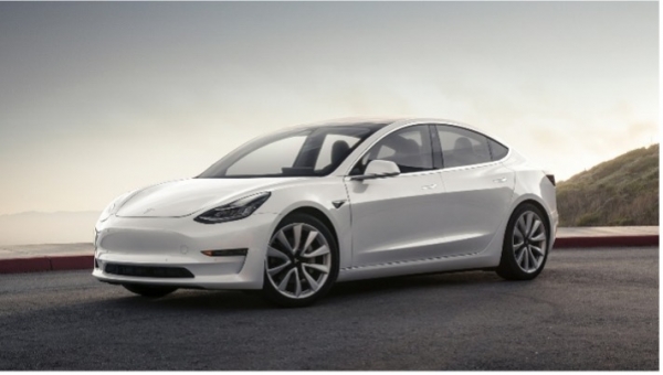 White Tesla Model 3 on the road