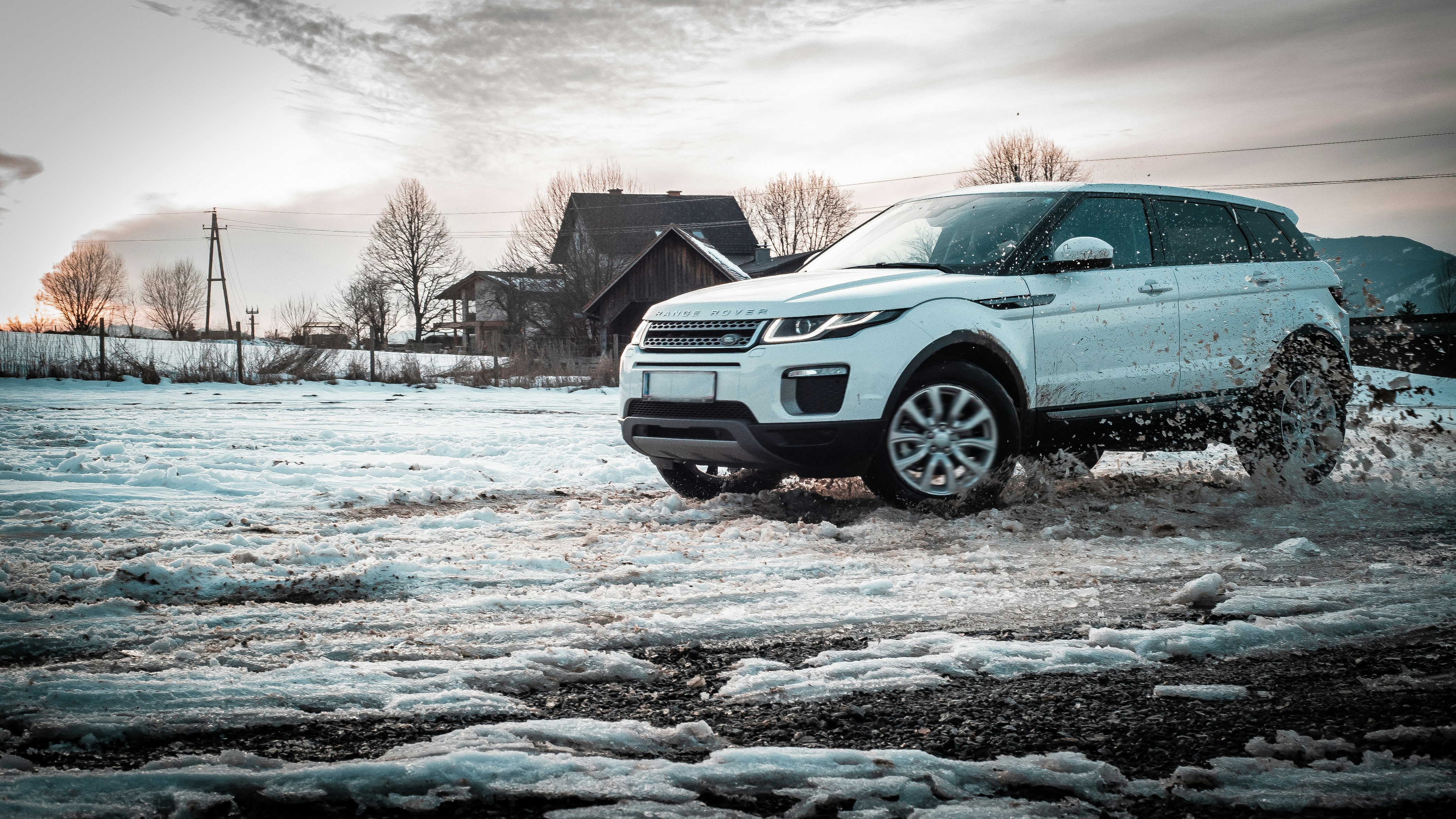 Range Rover driving through snow and icy conditions.