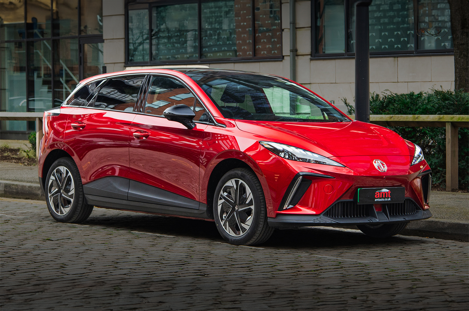 Red MG4 electric hatchback featured as one of the top affordable EVs for eco-friendly driving.