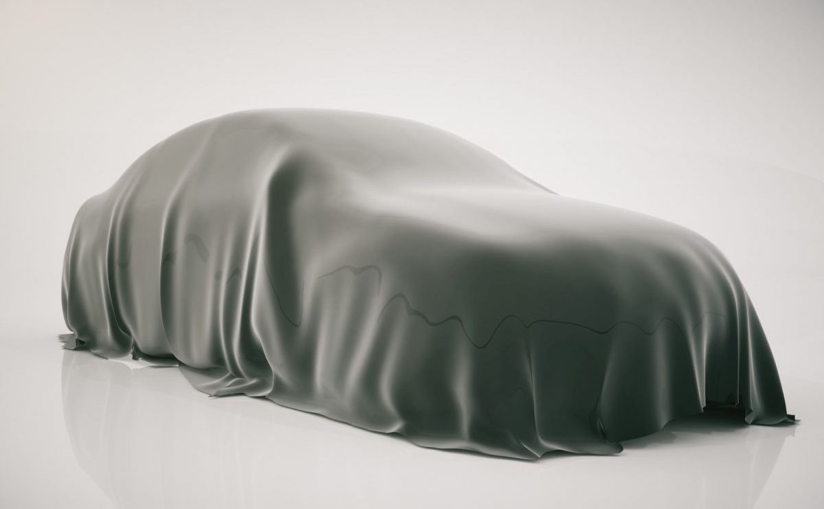A new car hidden under a silk cover, symbolising upcoming vehicle launches for 2020.