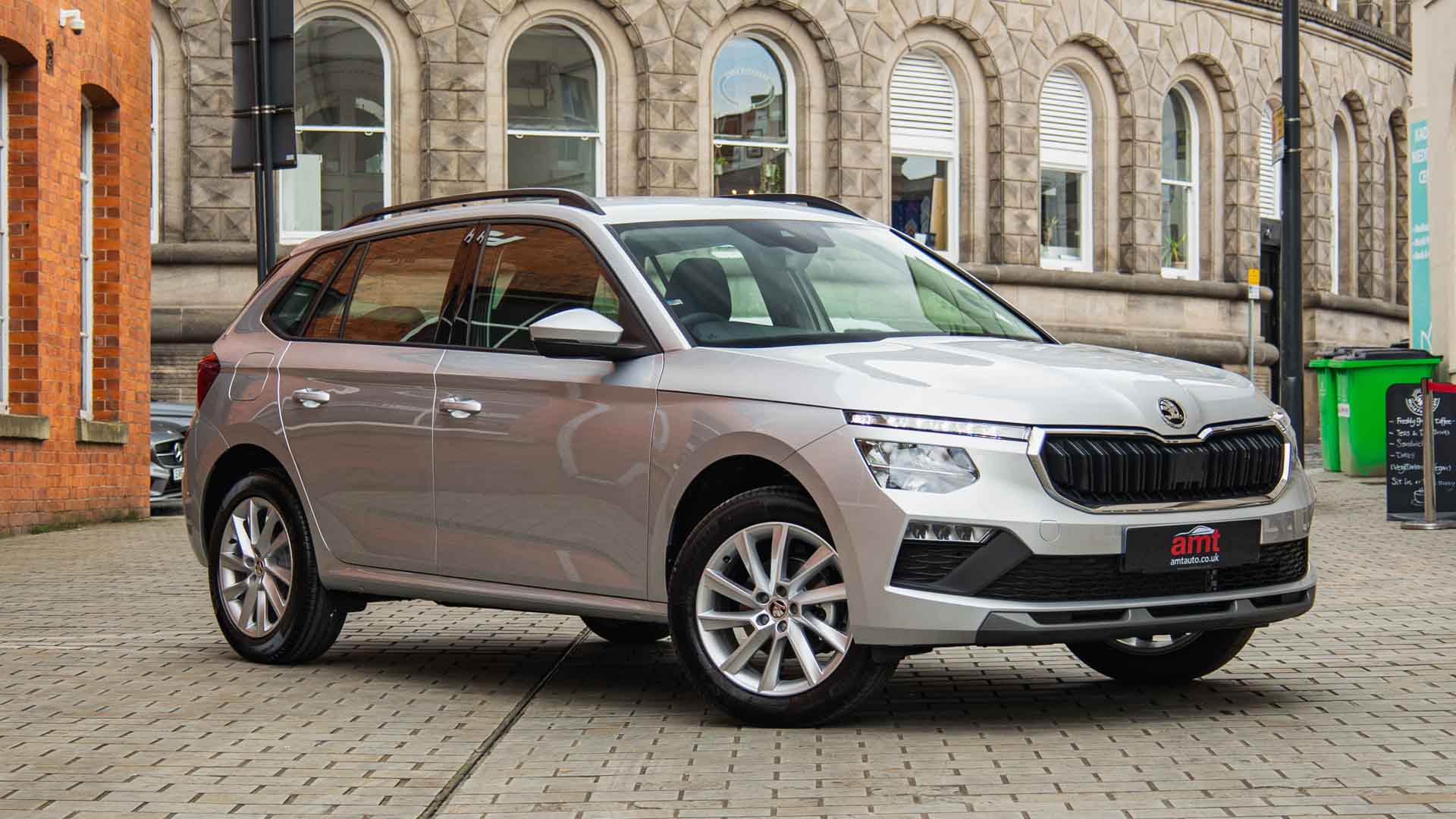 Affordable Škoda Kamiq parked in an urban setting – available with low-cost car leasing deals from AMT Auto
