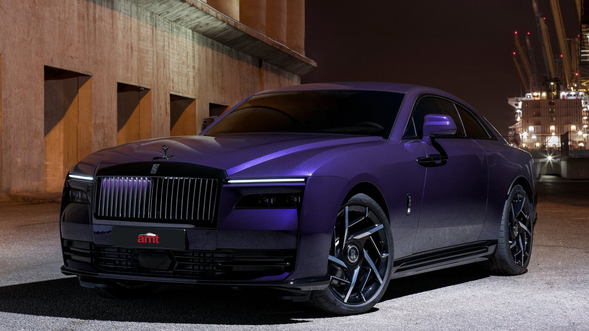 Rolls-Royce Spectre Black Badge in matte purple parked at night in an industrial setting.