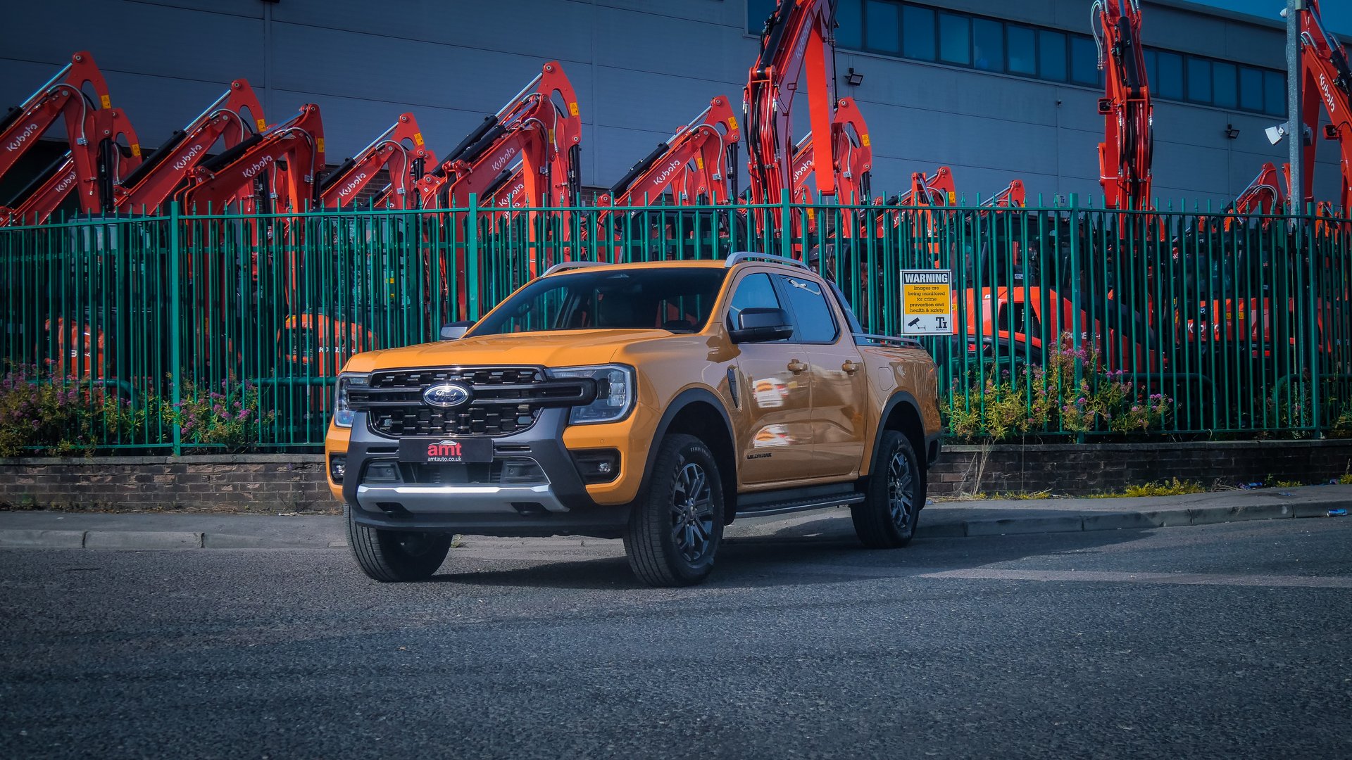 Ford Ranger Wildtrak pickup truck parked in an urban setting, showcasing its robust design and suitability for leasing.
