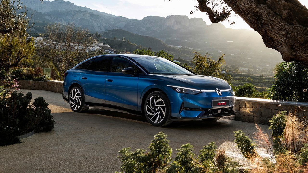 Volkswagen ID.7 parked in a scenic mountain setting, showcasing its sleek all-electric design and premium styling.