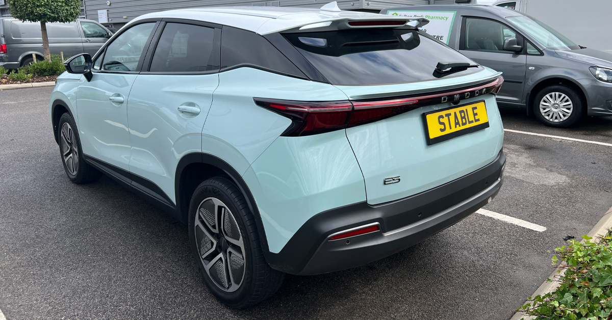 An image showing a 2024 Omoda E5 SUV in Jade Green metallic paint