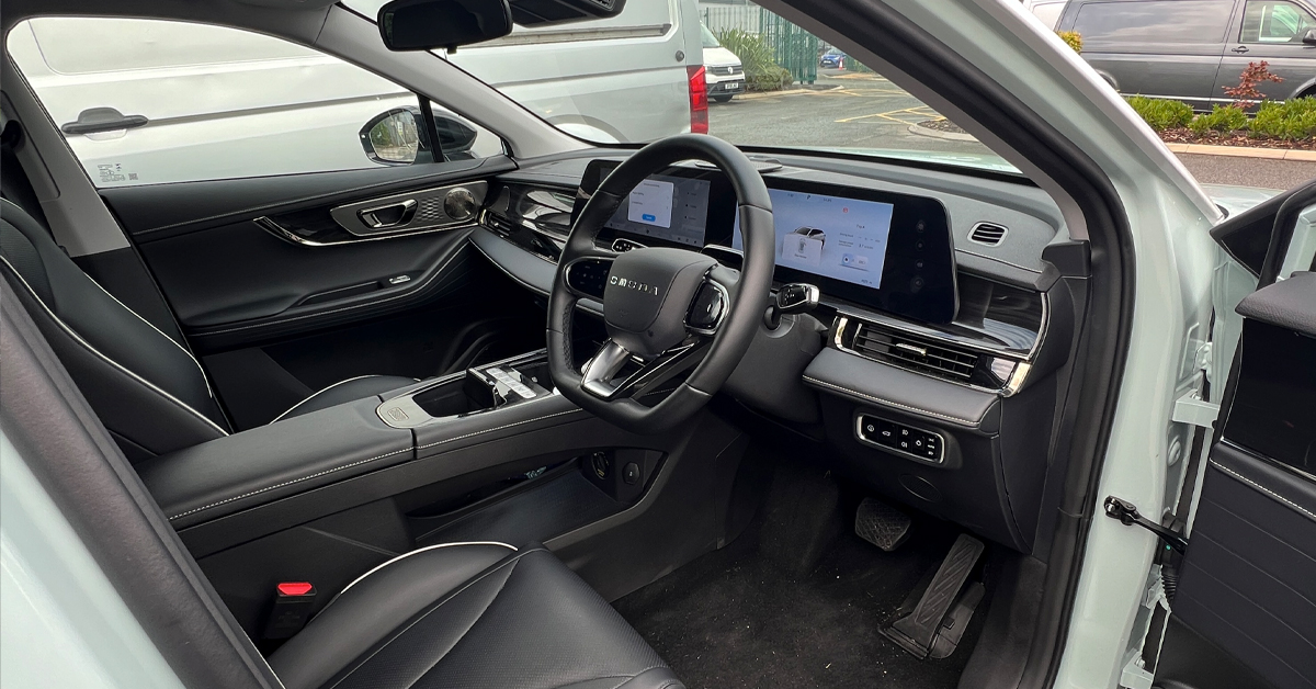 An image showing a 2024 Omoda E5 SUV interior dashboard and steering wheel